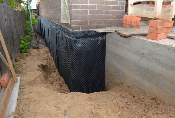 SJ Waterproofing Pros technician performing targeted Foundation Crack Repair assessment in Greens Fork, IN